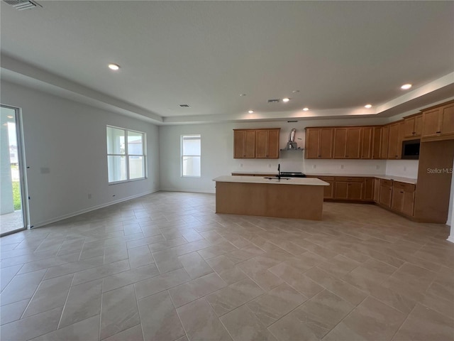 766 Hillshire Pl, Spring Hill, FL 34609 - kitchen featuring stainless steel microwave, extractor fan, open floor plan, a tray ceiling, and recessed lighting