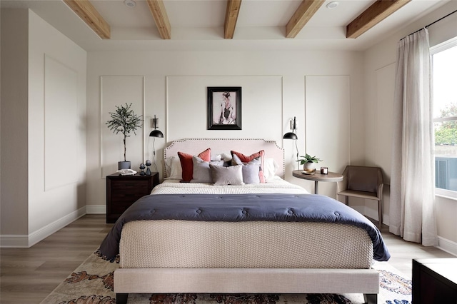 766 Hillshire Pl, Spring Hill, FL 34609 - bedroom featuring beam ceiling and light wood-type flooring
