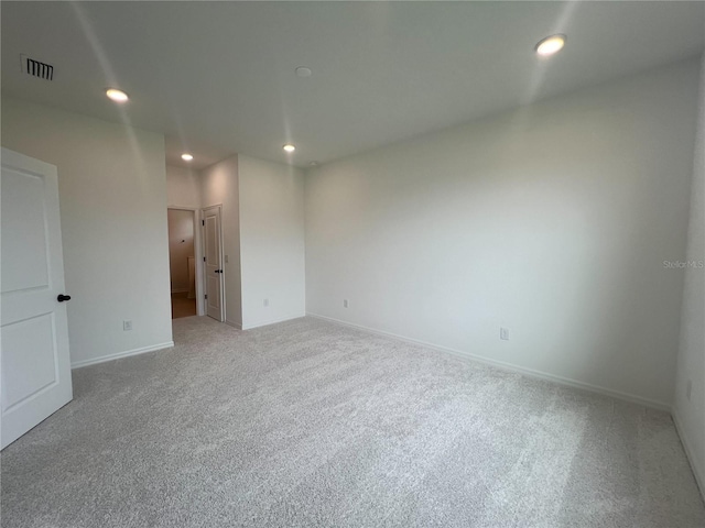 766 Hillshire Pl, Spring Hill, FL 34609 - unfurnished room featuring light carpet and recessed lighting
