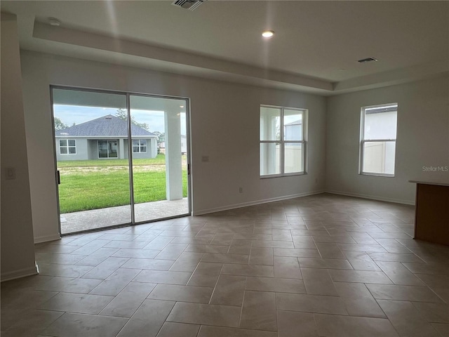 766 Hillshire Pl, Spring Hill, FL 34609 - empty room with a tray ceiling, recessed lighting, and a smoke detector