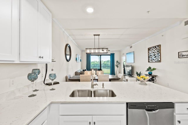 kitchen featuring ornamental molding, white cabinets, sink, and stainless steel dishwasher