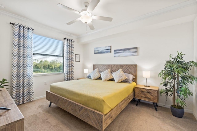 bedroom featuring crown molding, carpet, and ceiling fan