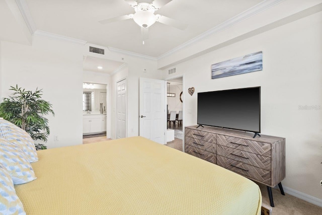 bedroom featuring carpet floors, crown molding, connected bathroom, and ceiling fan