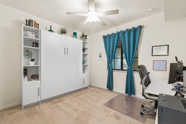 office area featuring ceiling fan and light colored carpet