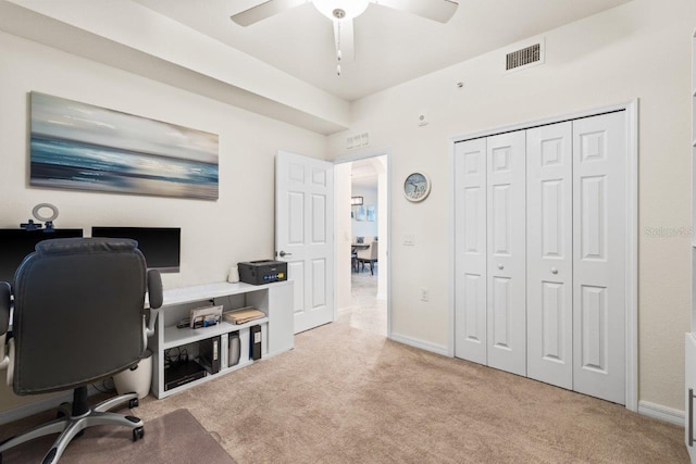 home office featuring light colored carpet and ceiling fan