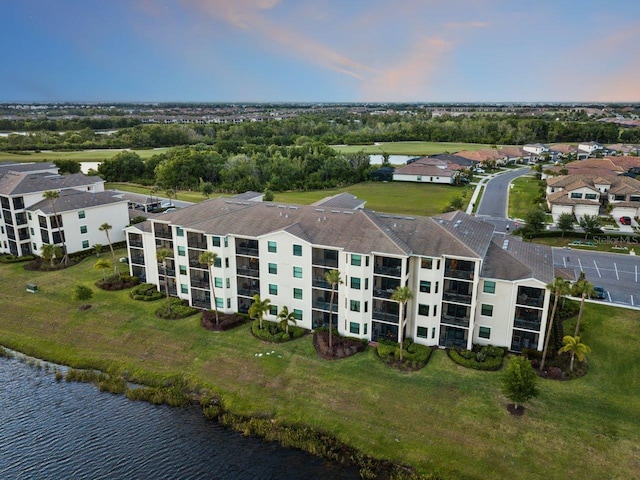 aerial view at dusk with a water view