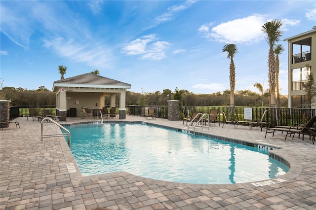 view of swimming pool with a gazebo and a patio