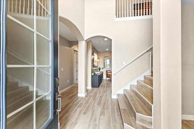 foyer entrance with hardwood / wood-style flooring