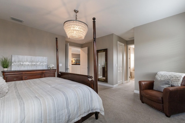 16215 Tradewind Ter, Lakewood Ranch, FL 34211 - bedroom with a chandelier, light carpet, baseboards, and ensuite bath