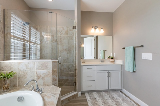 16215 Tradewind Ter, Lakewood Ranch, FL 34211 - full bath with a garden tub, a shower stall, vanity, and baseboards