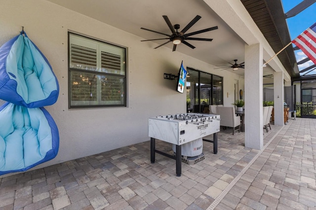 16215 Tradewind Ter, Lakewood Ranch, FL 34211 - view of patio / terrace with a ceiling fan, glass enclosure, and outdoor dining area