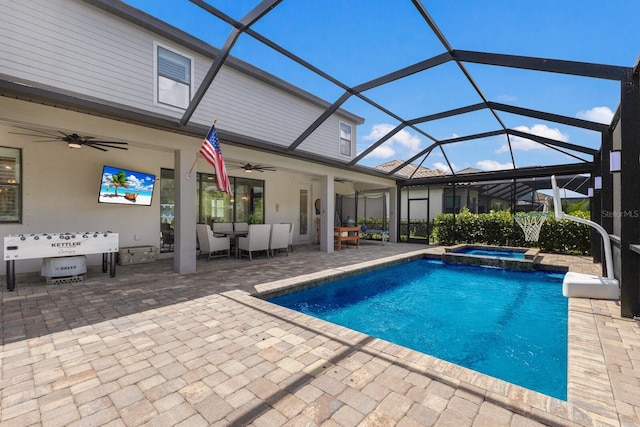 view of pool with a patio area, a lanai, an in ground hot tub, and ceiling fan