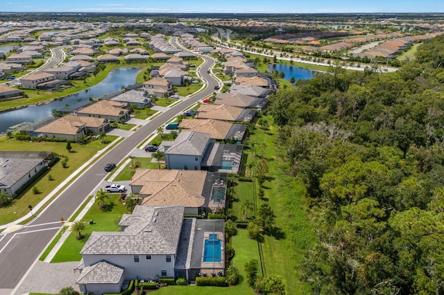 birds eye view of property featuring a water view