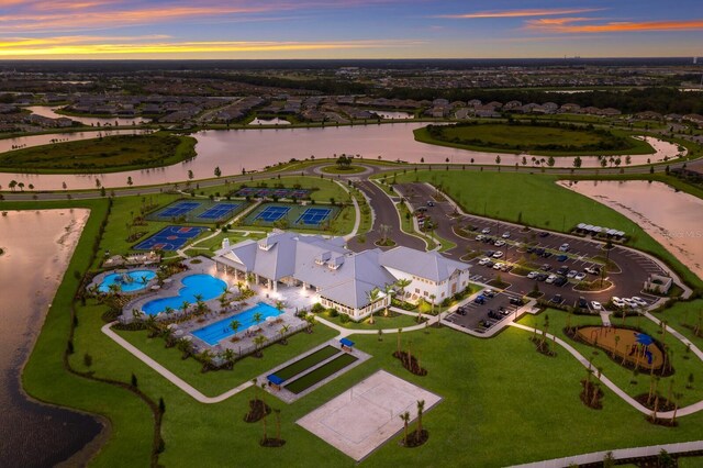 16215 Tradewind Ter, Lakewood Ranch, FL 34211 - aerial view at dusk of a water view and view of pool
