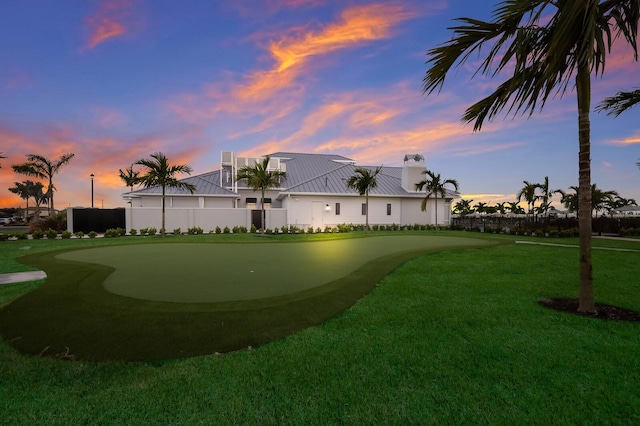 view of property's community with a lawn