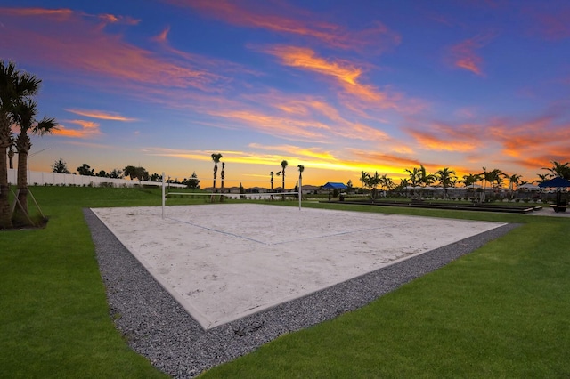 view of property's community with volleyball court and a lawn