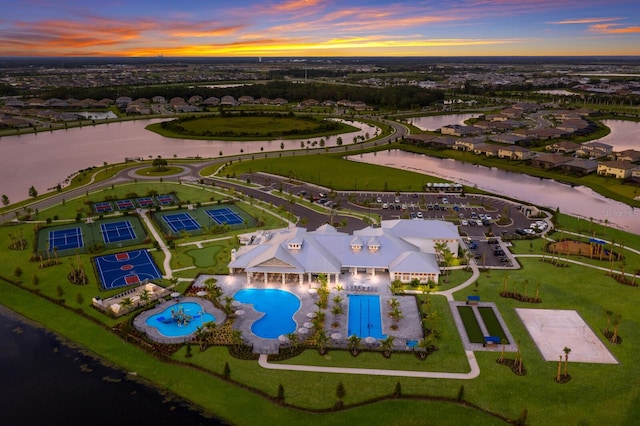 aerial view at dusk with a water view