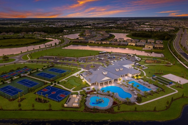 16215 Tradewind Ter, Lakewood Ranch, FL 34211 - aerial view at dusk of a water view, view of pool, and a residential view