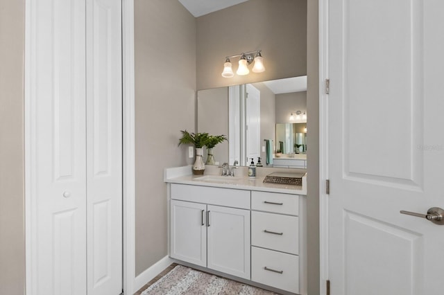 16215 Tradewind Ter, Lakewood Ranch, FL 34211 - bathroom featuring vanity, a closet, and baseboards