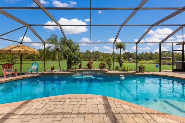 view of swimming pool with a patio, a lanai, and pool water feature