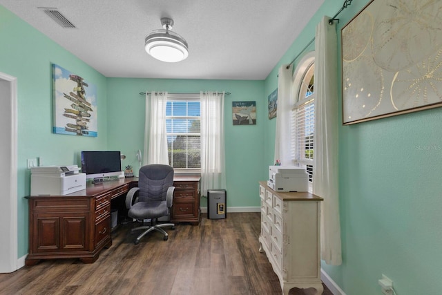 office featuring a textured ceiling and dark wood-type flooring