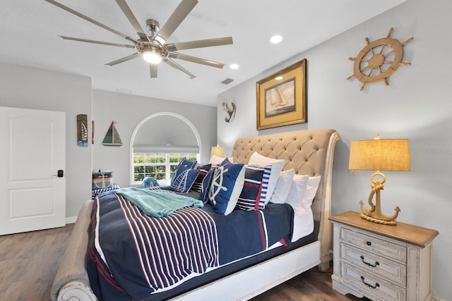 bedroom with ceiling fan and dark hardwood / wood-style flooring