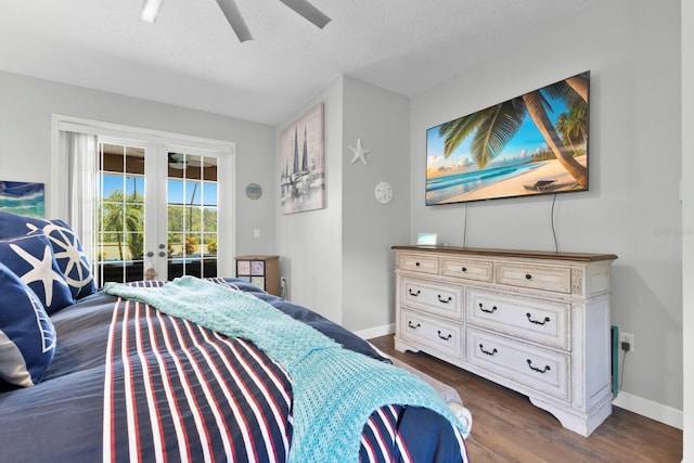 bedroom featuring a textured ceiling, access to outside, dark hardwood / wood-style flooring, ceiling fan, and french doors