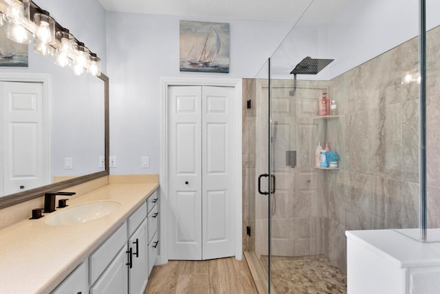 bathroom with vanity and an enclosed shower