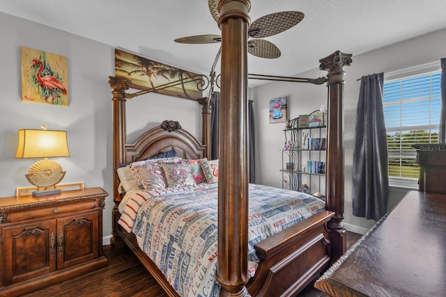 bedroom with ceiling fan and dark hardwood / wood-style floors