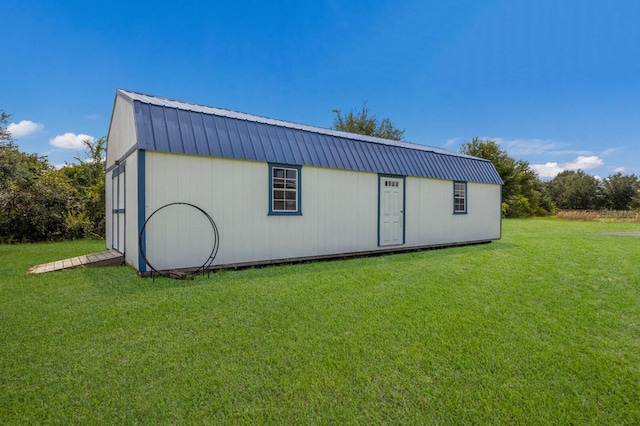 view of outdoor structure with a lawn