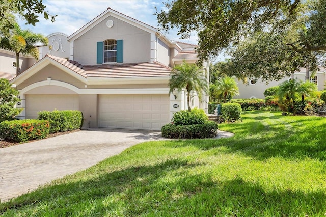 view of front of house with a front yard and a garage