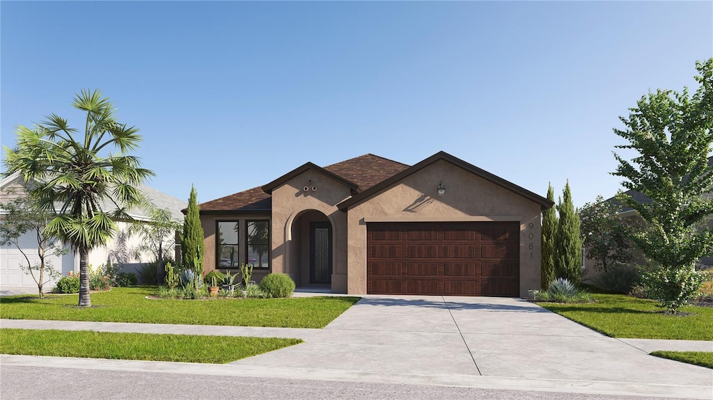 view of front facade with a front lawn and a garage