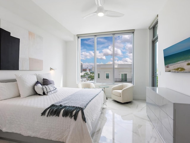 bedroom with marble finish floor and a ceiling fan