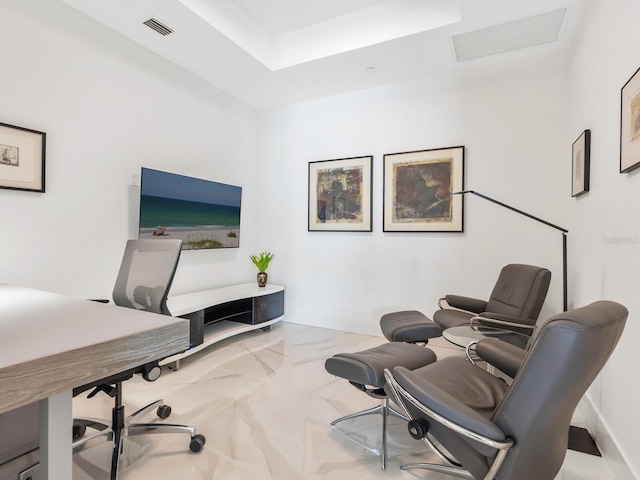 office space featuring a tray ceiling