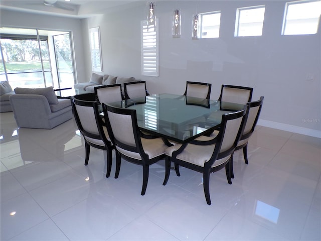 dining area featuring light tile patterned floors and a wealth of natural light