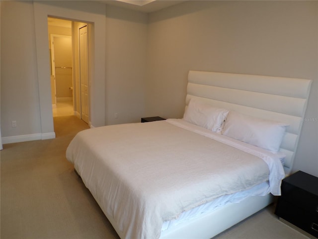 carpeted bedroom featuring a closet