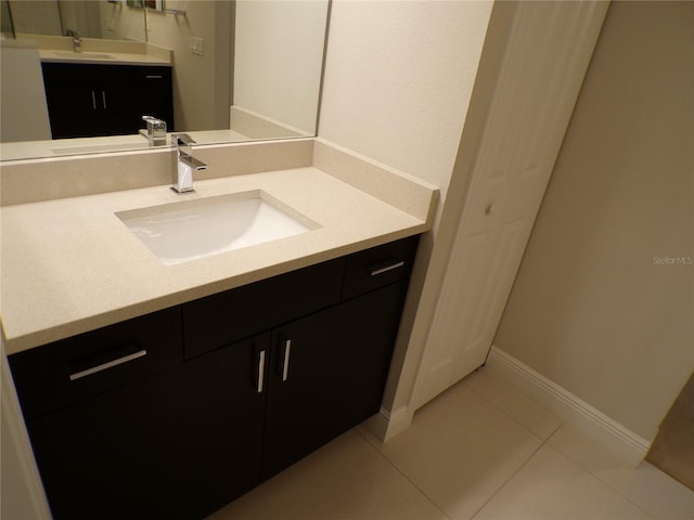 bathroom featuring vanity and tile patterned flooring