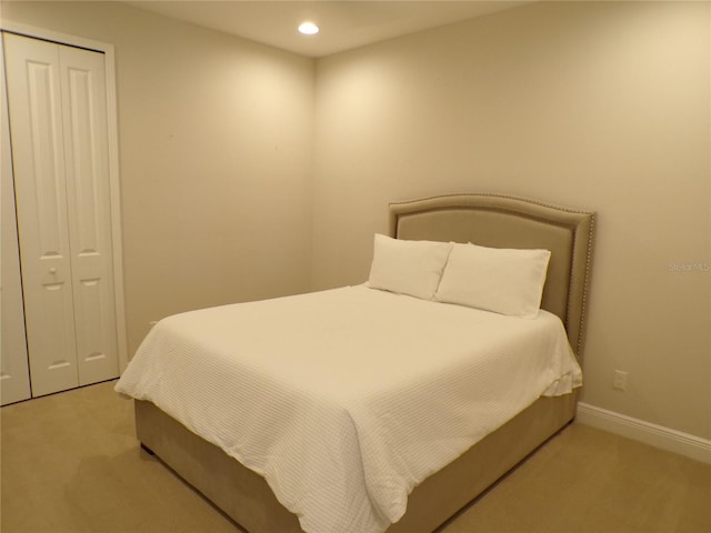 carpeted bedroom featuring a closet