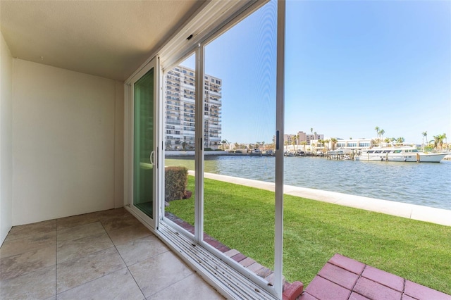 unfurnished sunroom with plenty of natural light and a water view