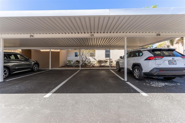 view of parking featuring a carport