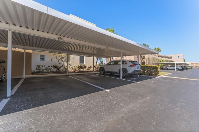 view of vehicle parking with a carport