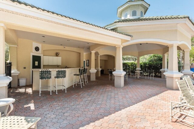 view of patio with a bar