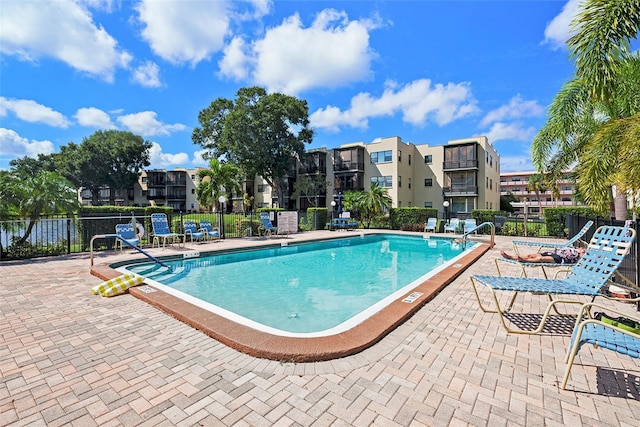 view of swimming pool featuring a patio