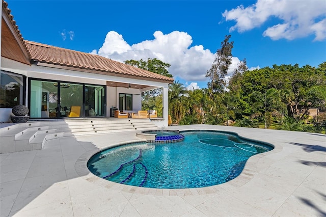 view of pool featuring an in ground hot tub and a patio area