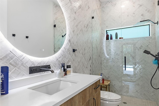 bathroom with decorative backsplash, tile walls, vanity, walk in shower, and toilet