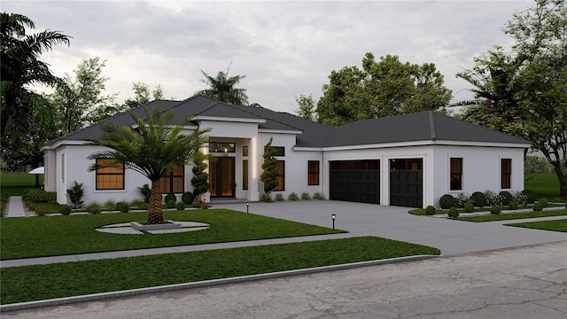 view of front facade with a front yard and a garage