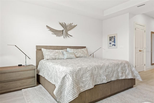 bedroom featuring light wood-type flooring