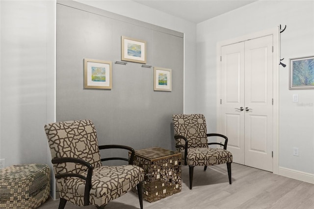 sitting room featuring light hardwood / wood-style flooring