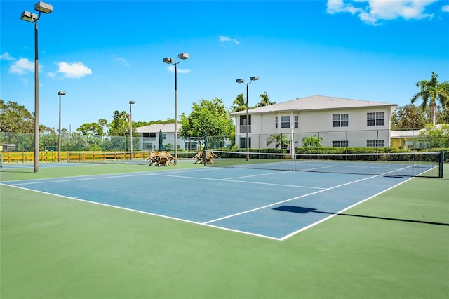 view of sport court with basketball hoop