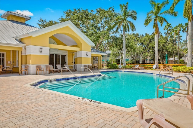 view of swimming pool with a patio area